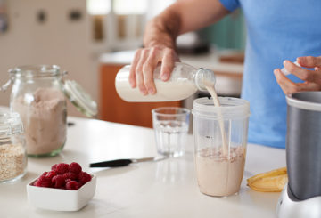 Man Making Protein Shake After Exercise At Home