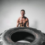 Six Pack Saturday #43 - Man working out by lifting a truck tire